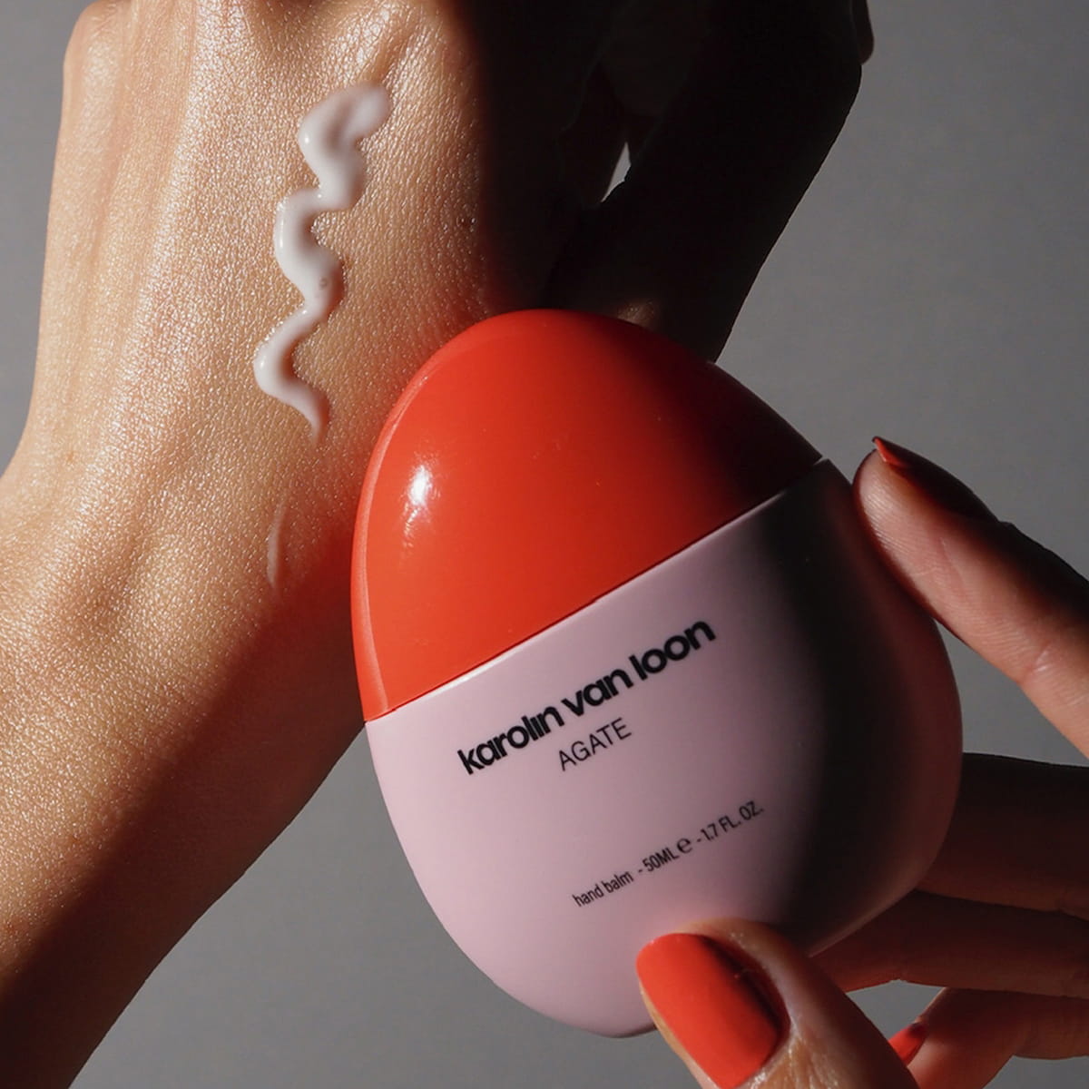 Karolin Van Loon Agate Hand Balm (50 ml) - product shown being held next to swatch on hand. 