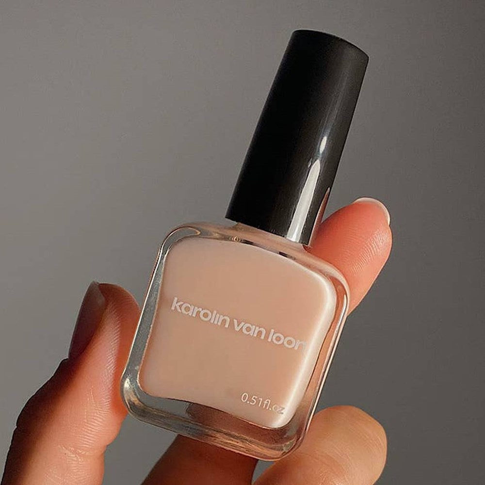 Karolin Van Loon Nail Polish - 26 La Premiere Base Coat (15 ml) - product shown being held. 