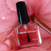 Karolin Van Loon Nail Polish - 56 Hydra Glow (15 ml) - product shown on flowers.
