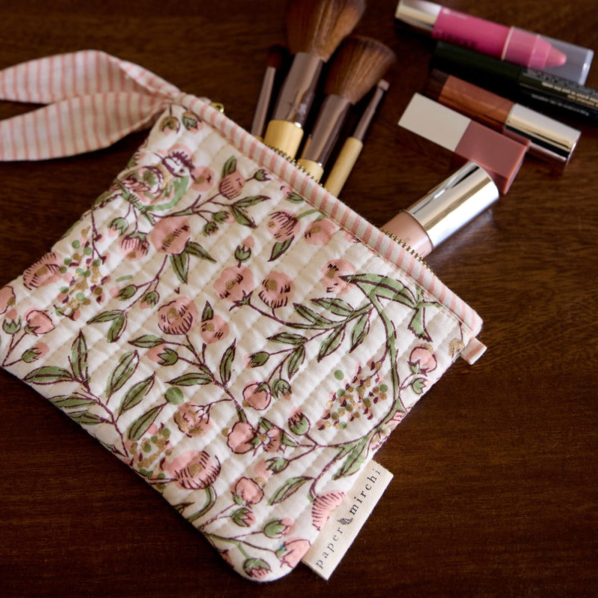 Paper Mirchi Organic Cotton Pouch Set - Floral Blush (2 pcs) - product shown on wooden counter. 