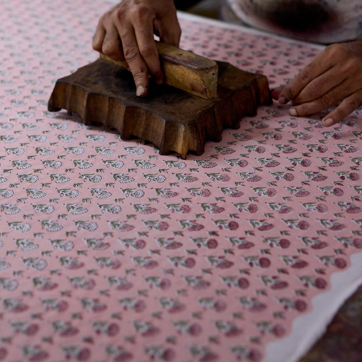 Paper Mirchi Organic Cotton Pouch Set - Floral Blush (2 pcs) - product shown being produced through block printing. 