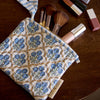 Paper Mirchi Organic Cotton Pouch Set - Floral Indigo (2 pcs) - product shown on wooden counter.