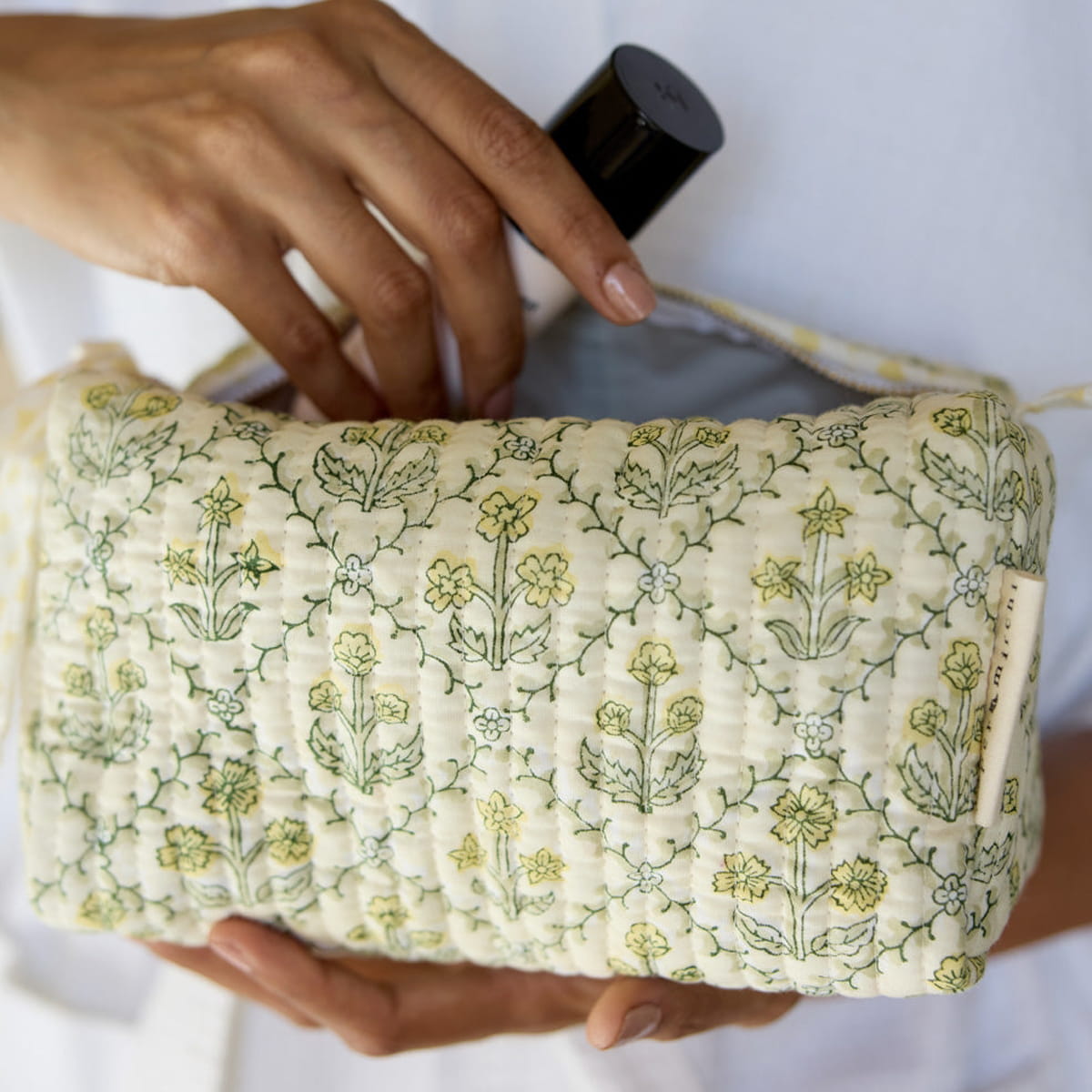 Paper Mirchi Organic Cotton Toiletry Bag - Floral Buttercream (1 pc) - product shown being held.