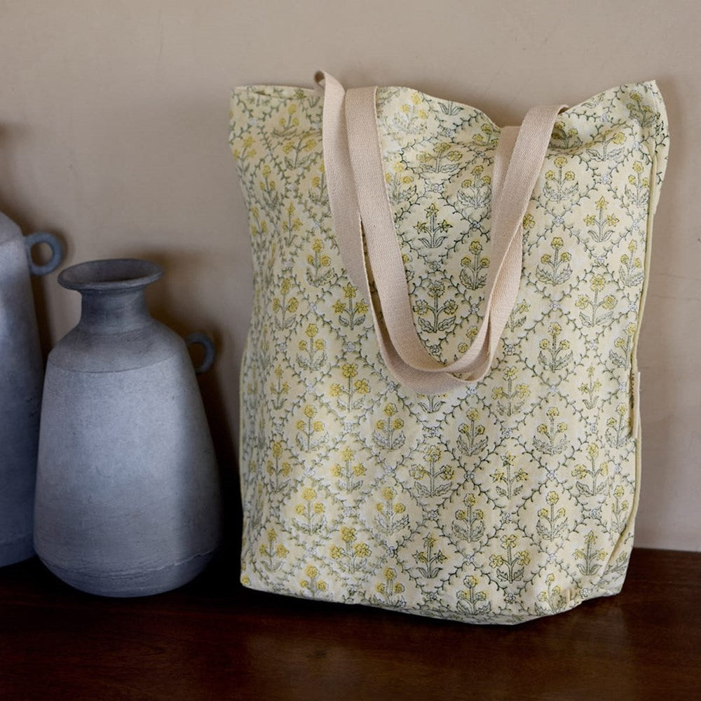 Paper Mirchi Organic Cotton Tote Bag - Floral Buttercream (1 pc) - product shown on counter. 