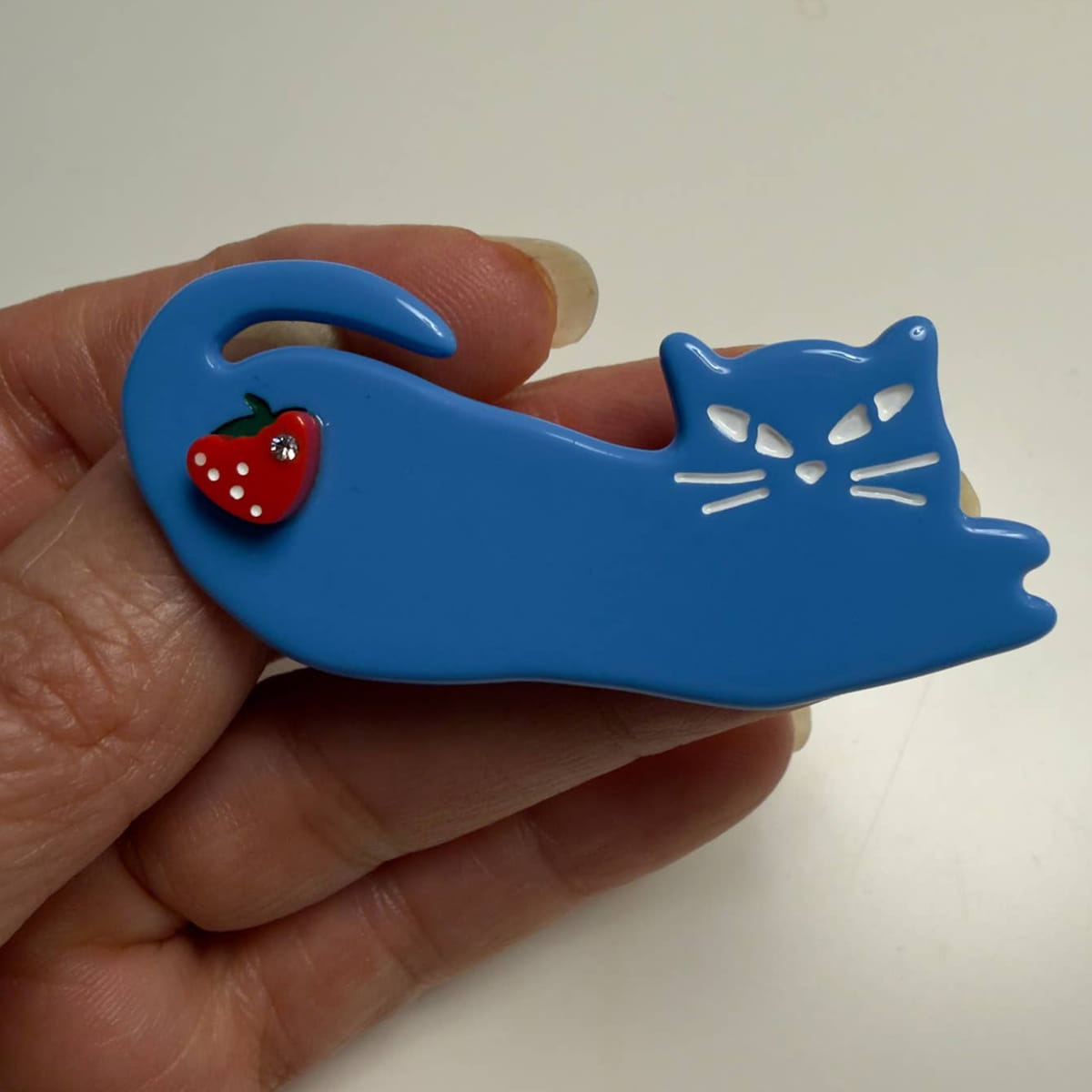Centinelle Fruit Cats Hair Clip Duo (2 pcs) - product shown being held. 