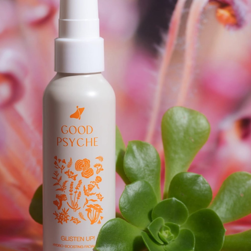 Good Psyche Glisten Up! Hydro Boosting Facial Mist (100 ml) - product shown on floral background.