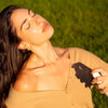 Good Psyche Glisten Up! Hydro Boosting Facial Mist (100 ml) - product shown being sprayed on model. 