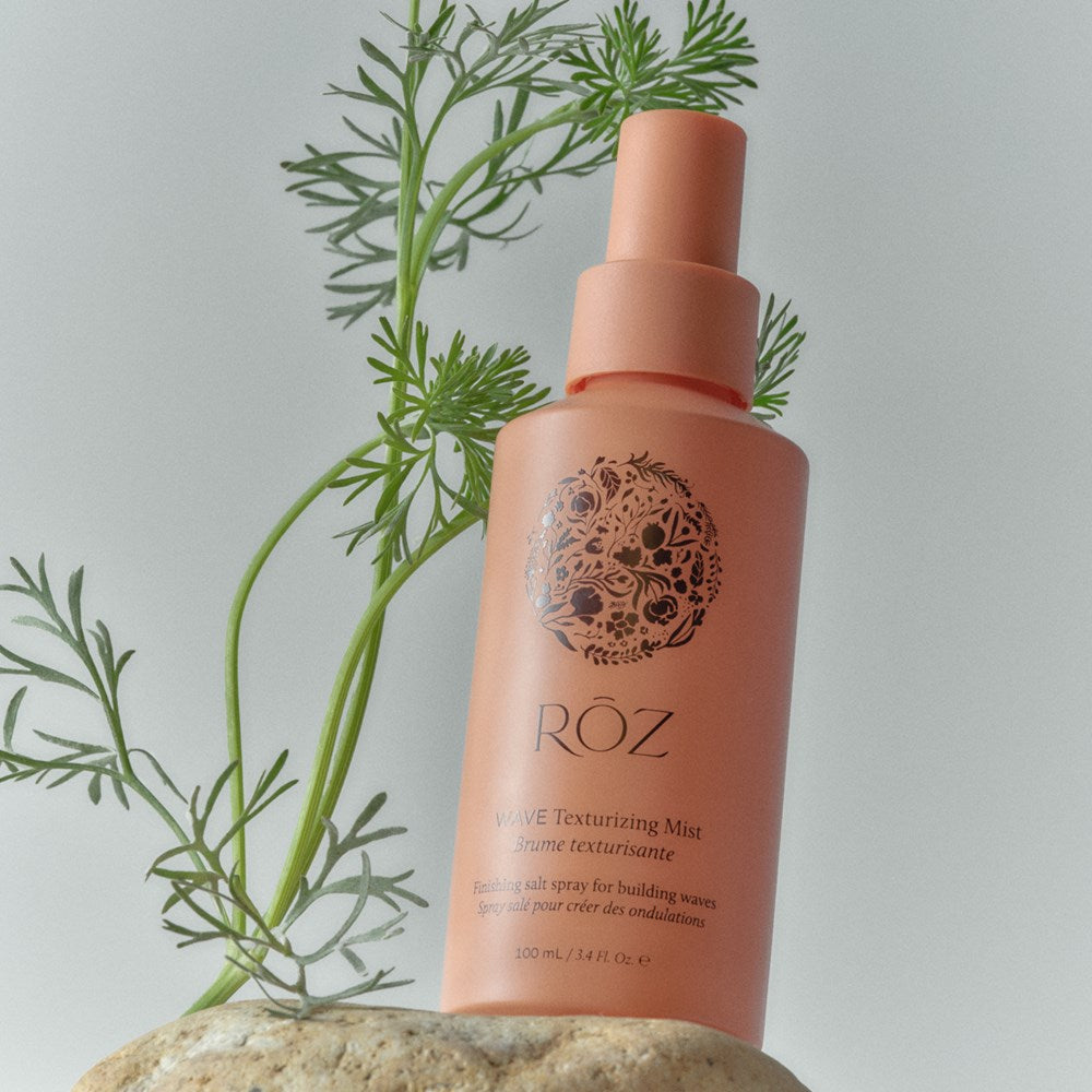 Roz Wave Texturizing Mist (100 ml) - product shown next to plant