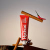 Davids Hydroxi Whitening + Enamel Health Toothpaste – Cinnamon (4 oz) - product shown with cinnamon sticks. 