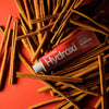 Davids Hydroxi Whitening + Enamel Health Toothpaste – Cinnamon (4 oz) - product shown with cinnamon sticks. 