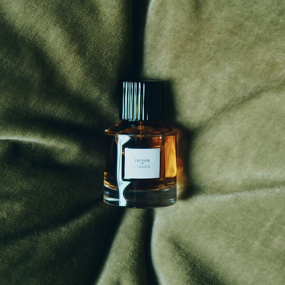 Trudon Carmen Eau de Parfum (100 ml) - product shown on green pillow. 