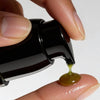 LAKA Hulali Botanical Retinol (30 ml) - product shown being put onto to finger. 