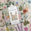 Botanica Paper Co. Botanist Reusable Bag (1 pc) shown folded with packaging and in background bag shown flat showing design