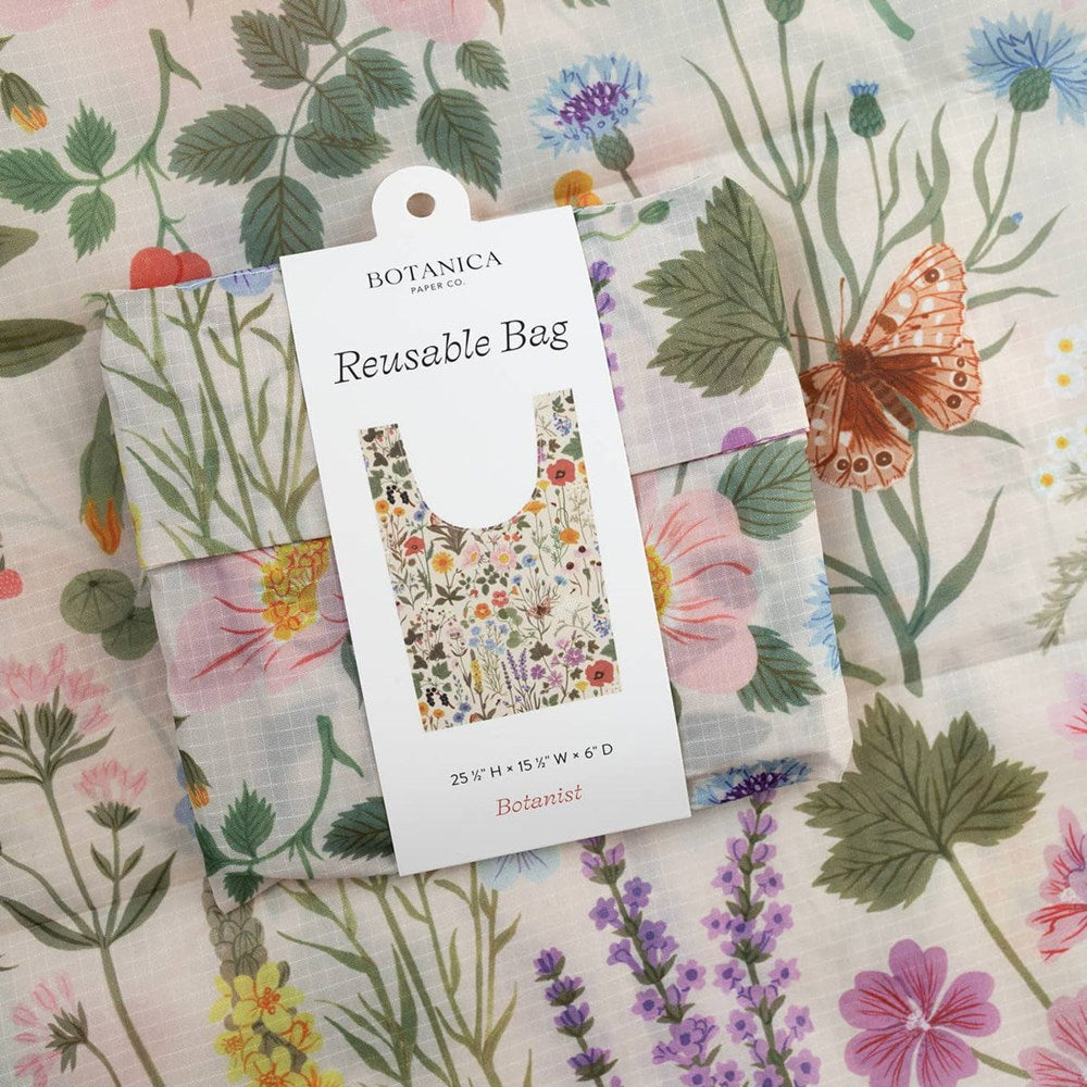 Botanica Paper Co. Botanist Reusable Bag (1 pc) shown folded with packaging and in background bag shown flat showing design