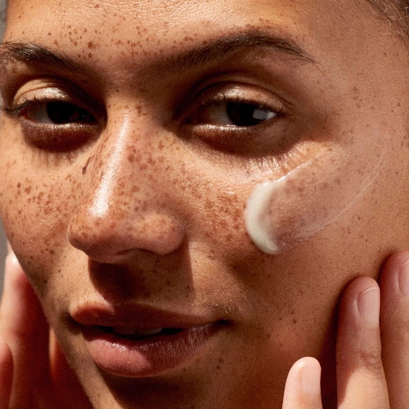 DUNE Suncare The Mug Guard (72 ml) - product shown swatched swatched on face.
