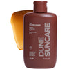 DUNE Suncare The Golden Guard (163 ml) - product shown in front of swatch. 