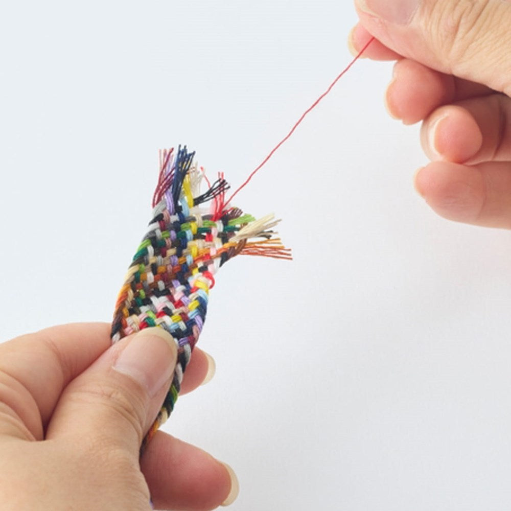 Hiro Thread Braids (1 pc) - product shown being unthreaded. 