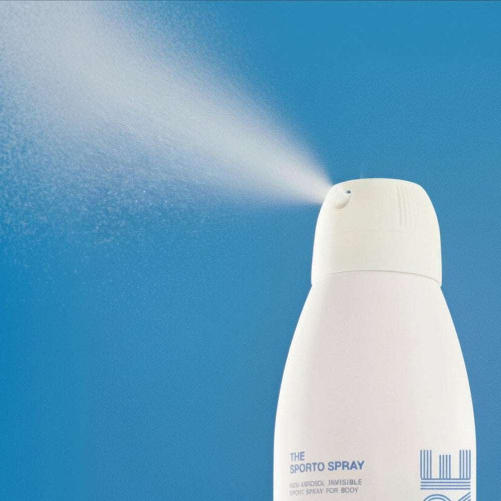 DUNE Suncare The Sporto Spray (148 ml) - against a blue background