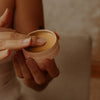 Sḵwálwen Botanicals Kalkáy Wild Rose & Yarrow Salve (1.81 oz) - product shown being held. 