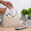 Evian Facial Spray (50 ml) - product shown being put in purse.