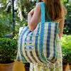 Talking Tables Recycled Plastic Sardine Fish Tote Bag (1 pc) - product shown on women's shoulder.
