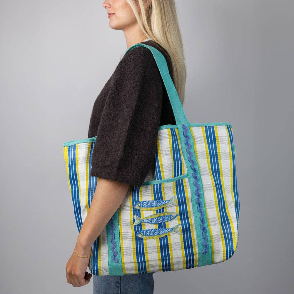 Talking Tables Recycled Plastic Sardine Fish Tote Bag (1 pc) - product shown on women's shoulder.