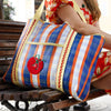 Talking Tables Recycled Plastic Tomato Tote Bag (1 pc) - product shown on women's shoulder.