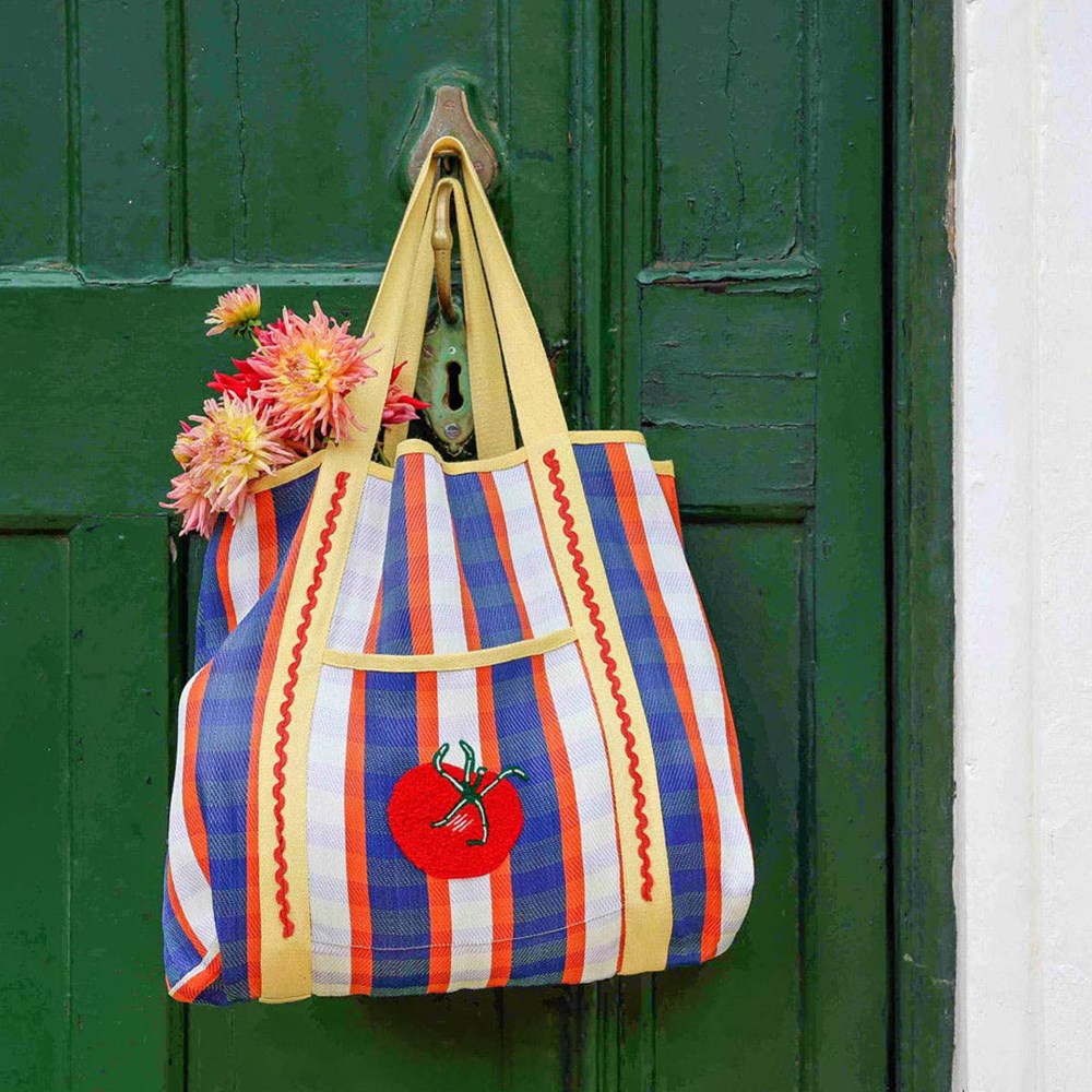Talking Tables Recycled Plastic Tomato Tote Bag (1 pc) - product shown hanging from door handle.