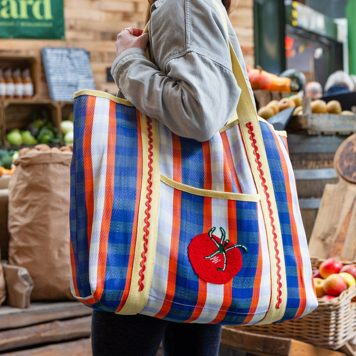 Talking Tables Recycled Plastic Tomato Tote Bag (1 pc) - product shown hanging from shoulder.