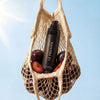 Le Prunier Plum Spritz (60 ml) - product shown in bag with plums.