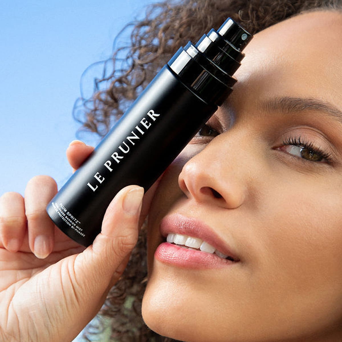 Le Prunier Plum Spritz (60 ml) - product shown being held by model.