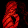 Heretic Parfum Smoke Box Eau de Parfum (5 x 2 ml) - product shown being held by model. 