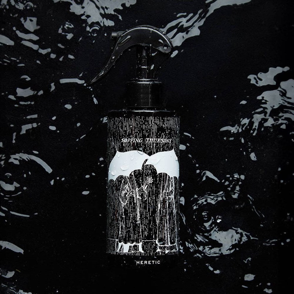 Heretic Parfum Sopping Thursday Room Spray (200 ml) - product shown on water.