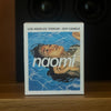 Naomi Los Angeles Terroir Candle (283 g) - product shown on wooden counter top. 