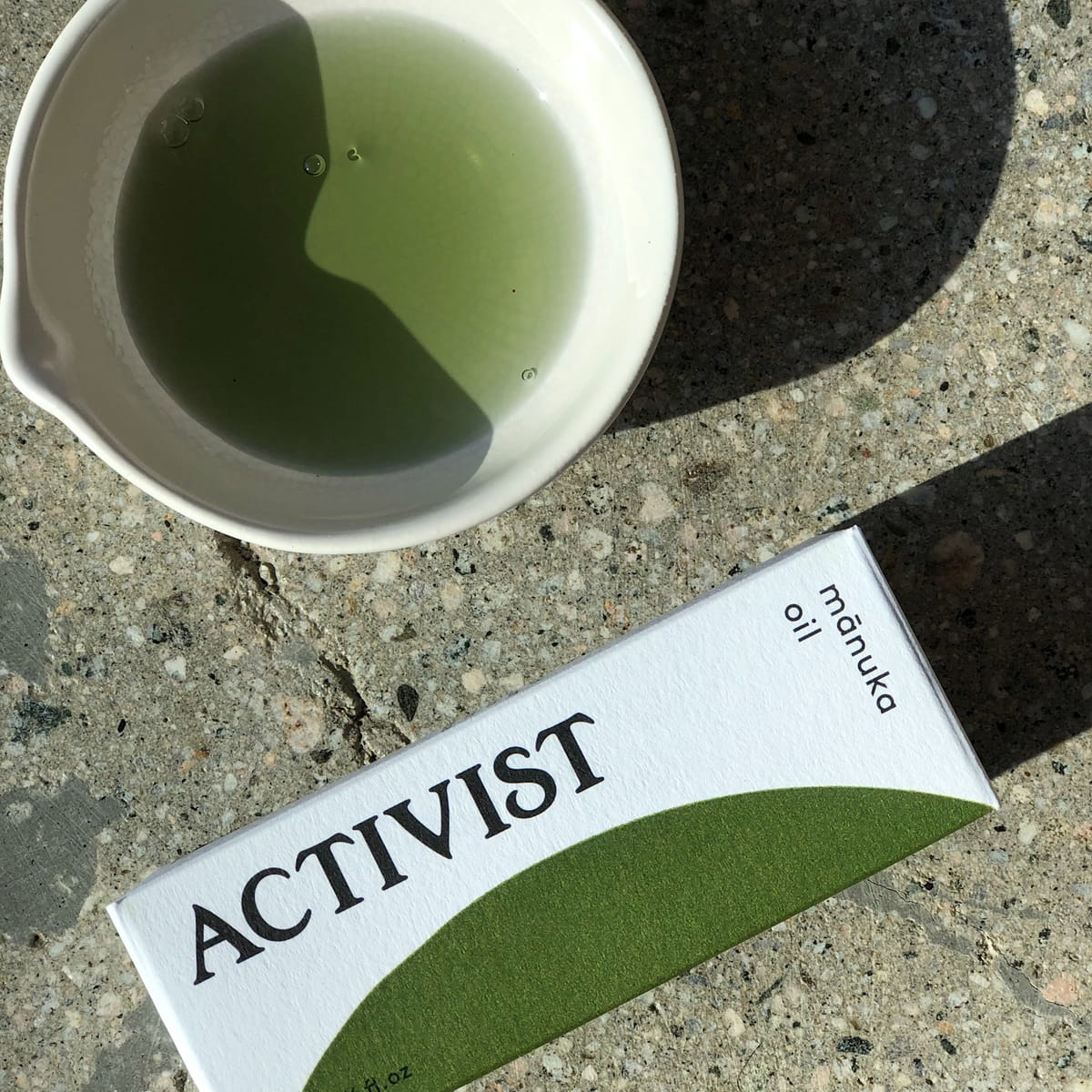 Activist Manuka Essential Oil (15 ml) - product shown on concrete.