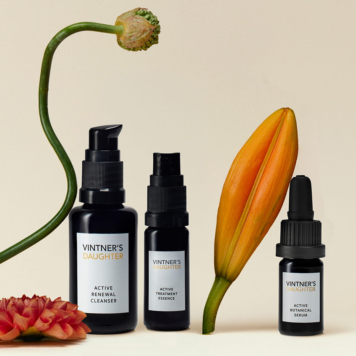 Vintner's Daughter The Discovery Set (3 pcs) - product shown with a beige background with flowers in the foreground and background of products