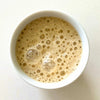 Chand & Radha Mango Ayurvedic Functional Latte Blend (210 g) - product shown in cup.