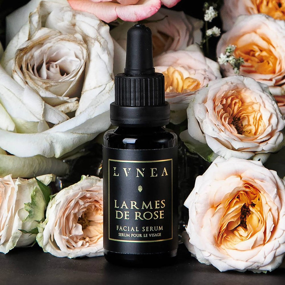Lvnea Perfume Larmes De Rose Facial Serum (20 ml) - product shown with roses around it.