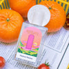 Lifestyle shot, close up of Maison Matine Shifumi Eau de Parfum (100 ml) with oranges in the background