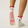 Model wearing Effortless Club Strawberry Ruffle Grip Socks (1 pair) showing partial side view and back side of sock