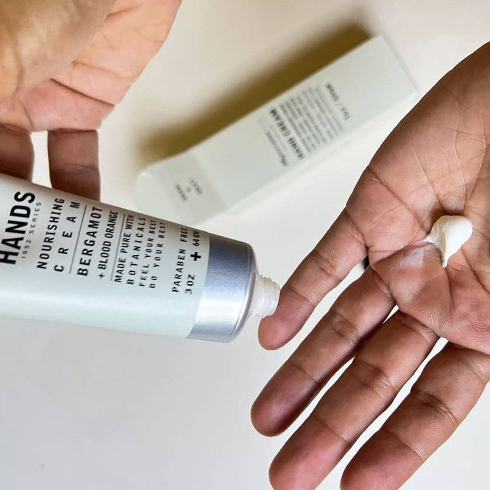 Mayron’s Goods Hands Softening Hand Cream (64 g) - product shown being applied to hands.
