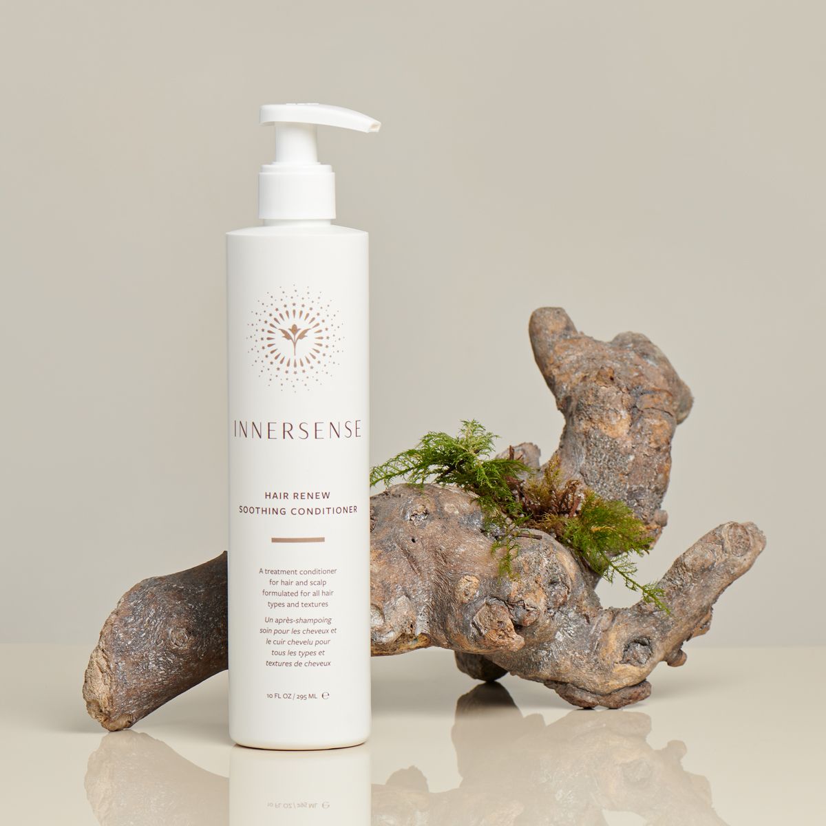 Innersense Organic Beauty Hair Renew Soothing Conditioner - product shown in front of piece of wood.