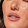 Cote The Ritual Peptide Enriched Lip Treatment (10 ml)  - product shown on model's lips.