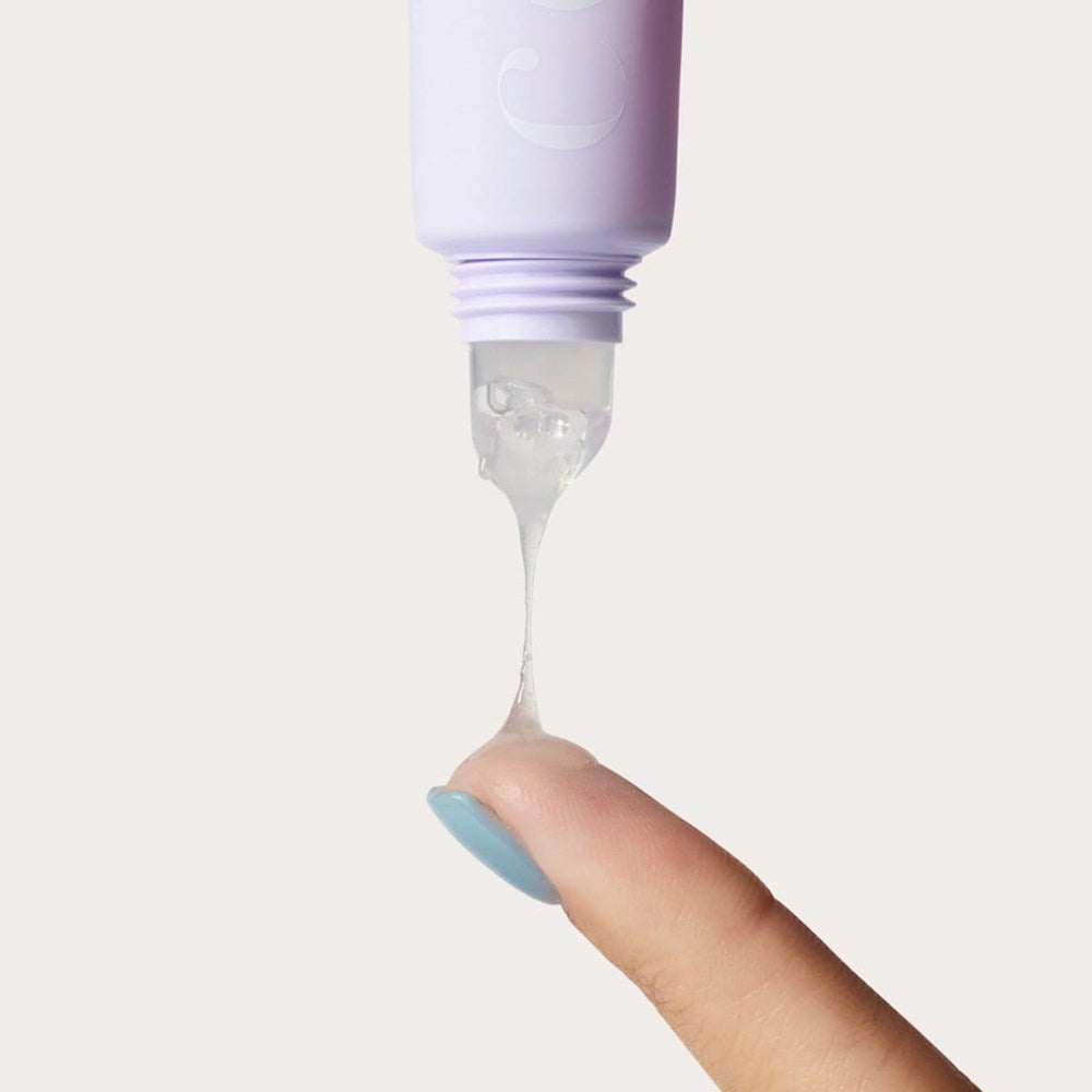 Cote The Ritual Peptide Enriched Lip Treatment (10 ml)  - product shown being applied to woman's finger.