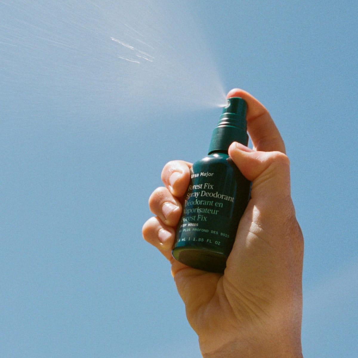 Ursa Major Forest Fix Spray Deodorant (1.85 oz) - product shown being sprayed.