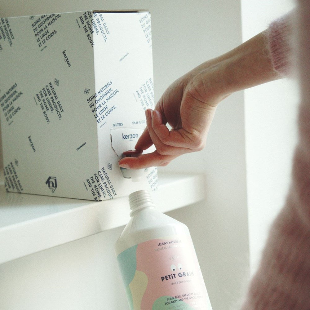 Kerzon Laundry Soap Refill - Petit Grain (3 L) - product shown being refilled.
