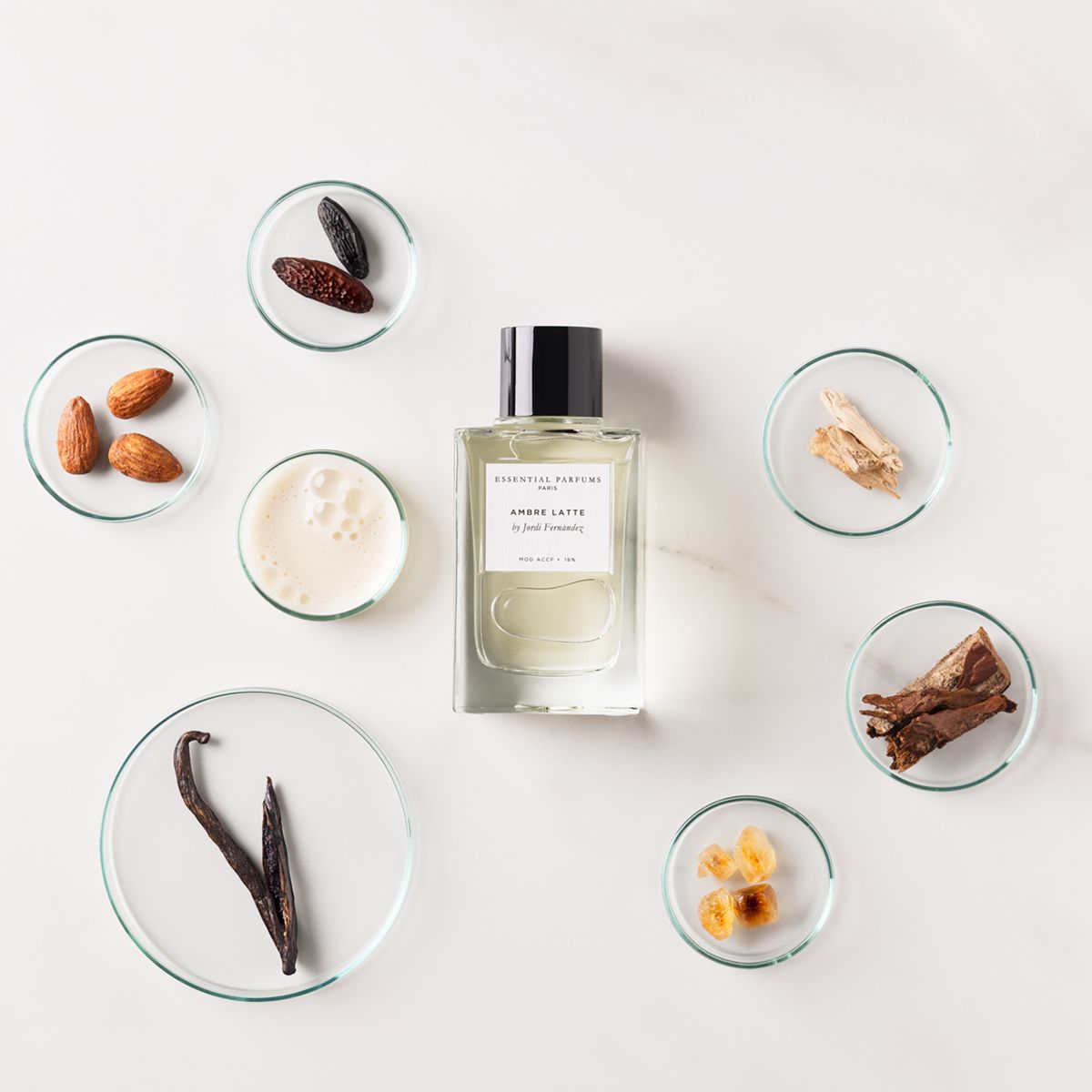 Essential Parfums Ambre Latte by Jordi Fernandez (100 ml Refillable) - product shown with ingredients. 