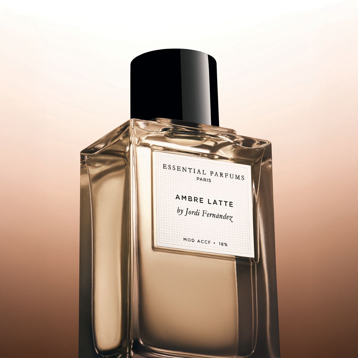 Essential Parfums Ambre Latte by Jordi Fernandez (100 ml Refillable) - product shown on gradient background. 