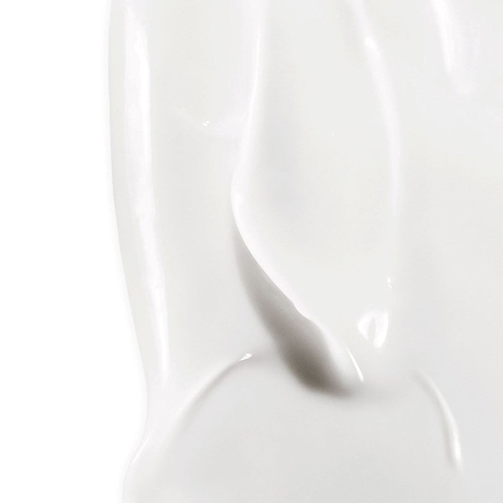 Diptyque Comforting Moisturizing Lotion (350 ml) - product shown as swatch. 