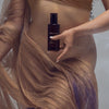 Heretic Parfum Haxan Body Oil (150 ml) - product shown being held by model!